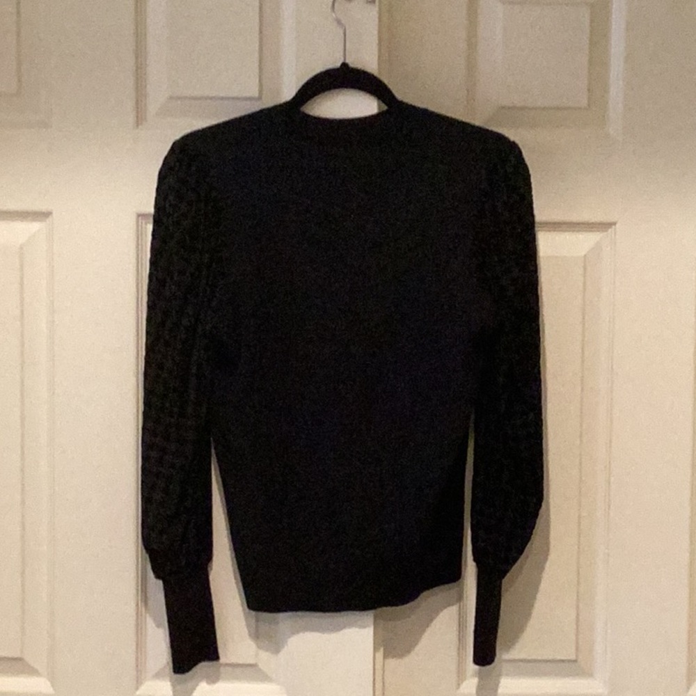 Black Fate sweater, sleeve has mesh detail with houndstooth detail